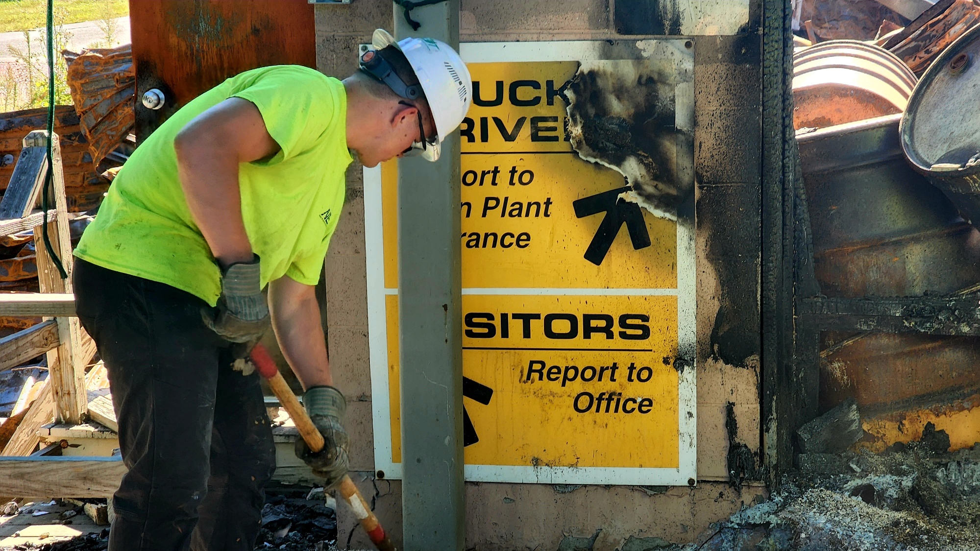 NEDT staffer cleaning up debris from the Dudley Chemical Fire.
