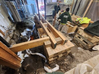 A larger home project that required complete floor removal and soil remediation, including removing support columns. You can see both temporary supports as well as setup for new concrete pours once remediation is completed.